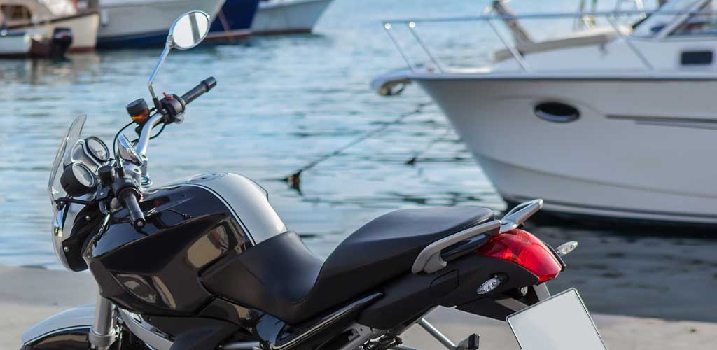 Motorcycle parked on a boat pier