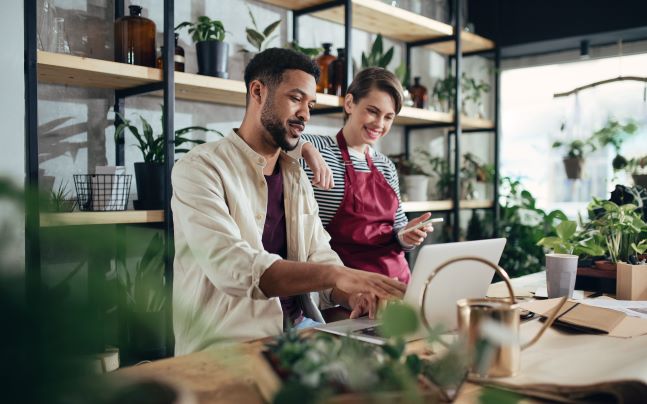 Man and woman on computer at their business