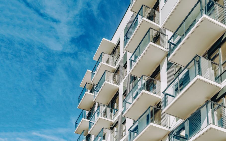 Side view of condos and blue sky on. the background