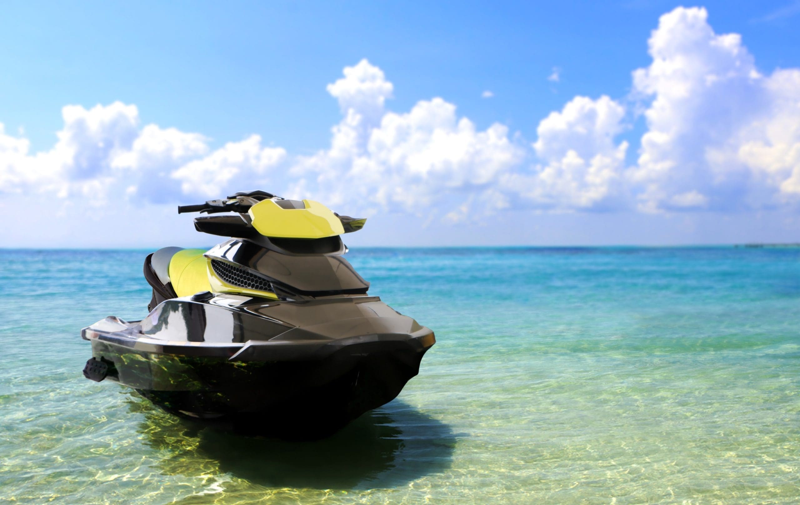 Jetski at the beach under cloudy sky.
