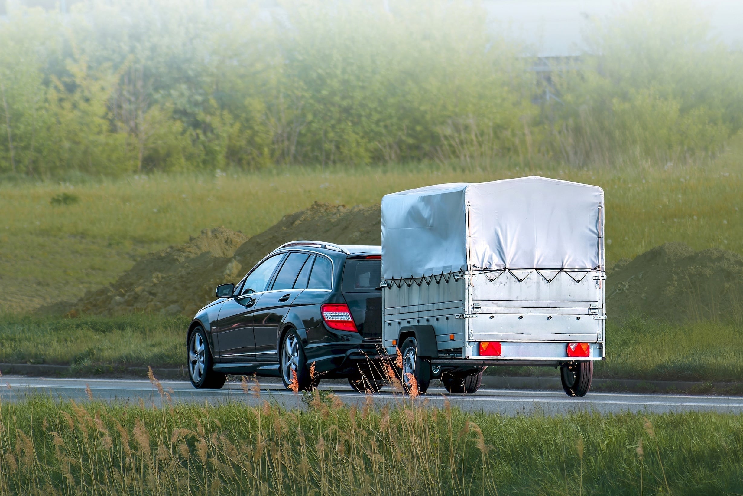 SUV with trailer attached.