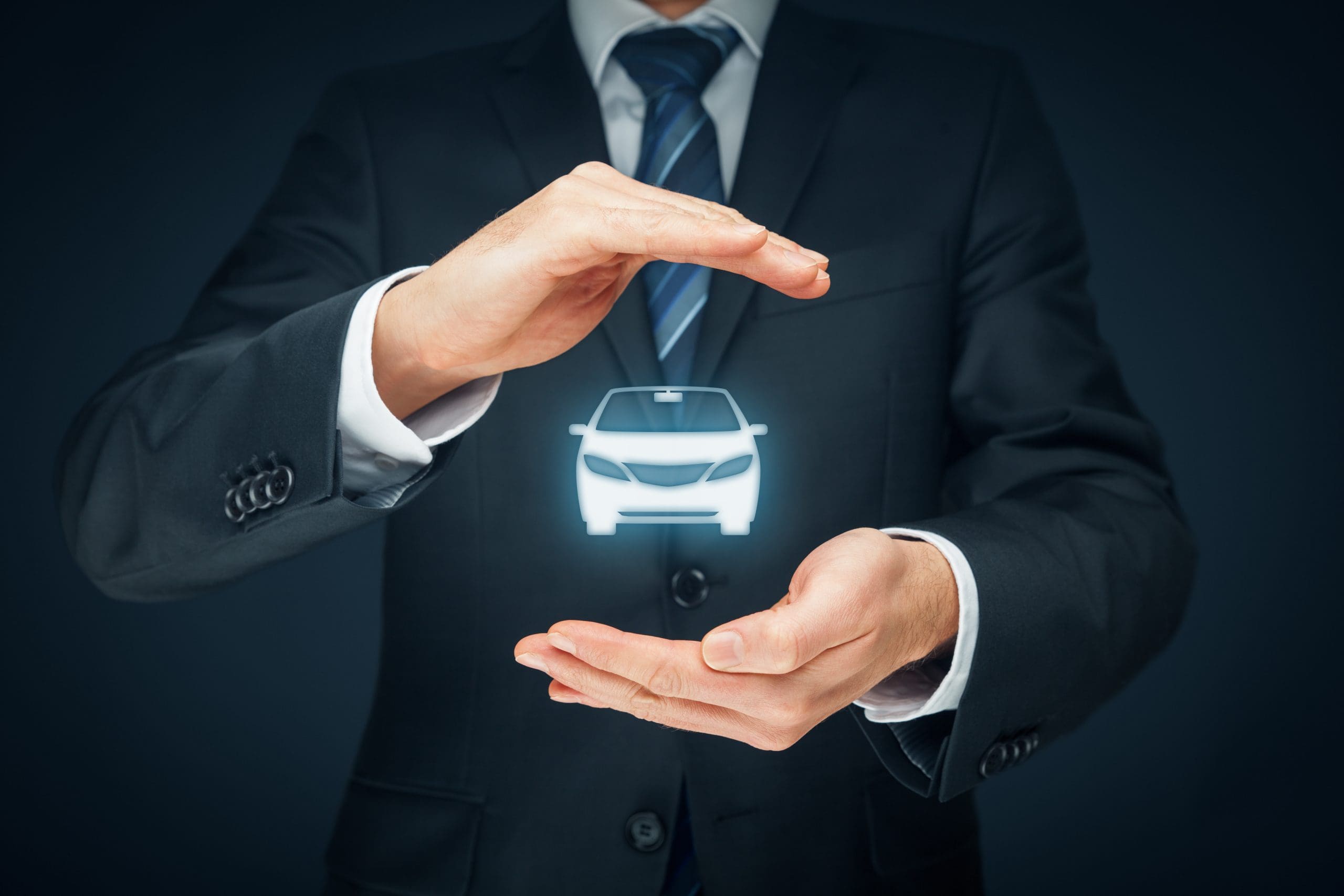 Person making circle with hands with car in the center.