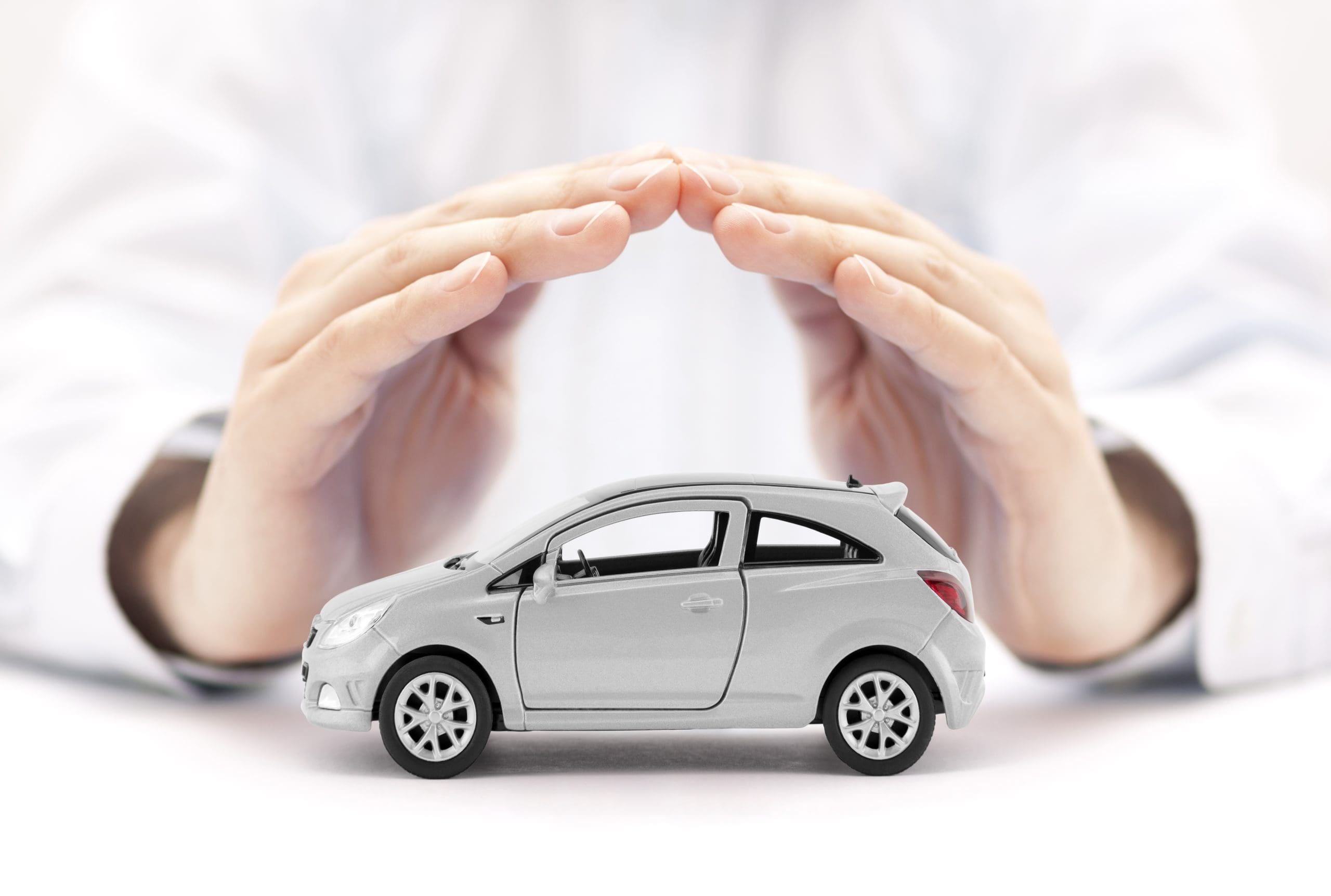 Person making semicircle over car toy.